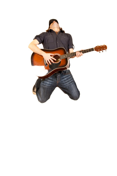 Un guitariste passionné saute
 - Photo, image