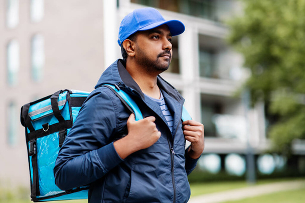 indian delivery man with bag in city - Valokuva, kuva
