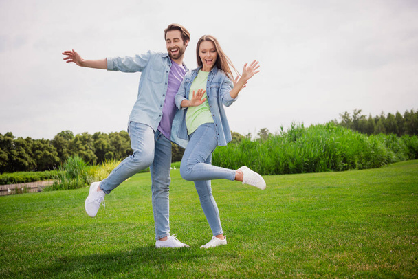 Full size photo of smiling good mood dancing couple enjoying free time active energetic weekend spend free time - Fotó, kép