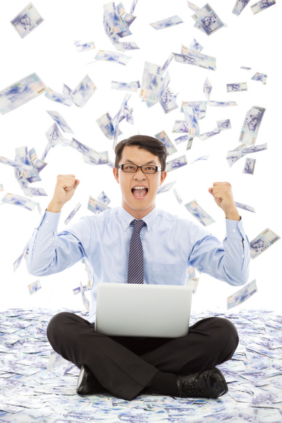 Business man make a victory gesture with money rain - Photo, Image