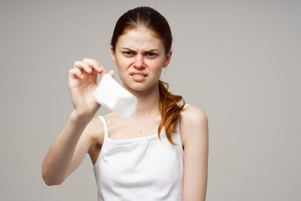 woman in white t-shirt with napkin close-up. High quality photo - Photo, Image