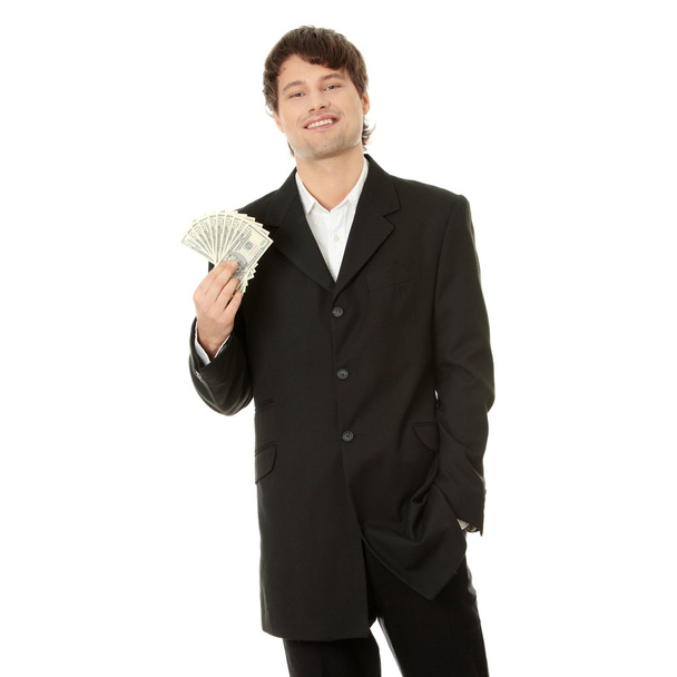 Young handsome businessman holding dollars - Zdjęcie, obraz