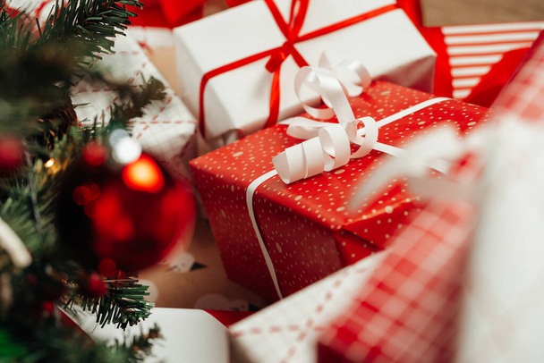 Pile of wrapped presents under the Christmas tree - Valokuva, kuva