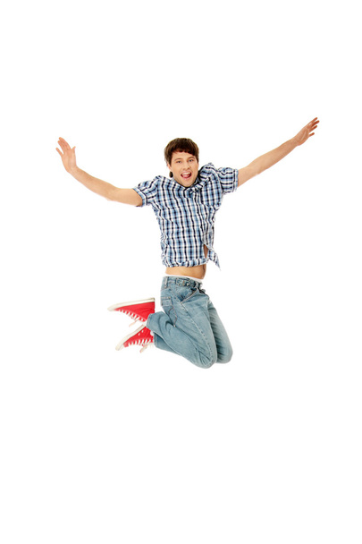 młody szczęśliwy człowiek kaukaski skoki w powietrzu - Zdjęcie, obraz
