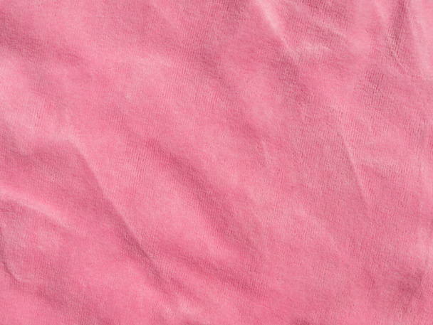 Pink color velvet fabric texture top view. Female blog rose velour tactile background. Smooth soft fluffy velvety satin cloth metallic shiny material.Elegant luxury wallpaper for girls fashion website - Photo, Image