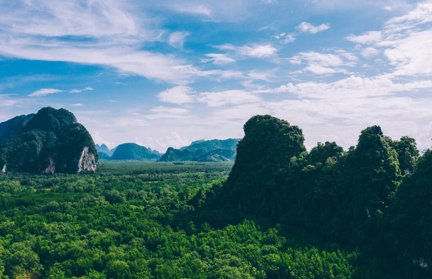 Aerial scenery view of jungle forest and mountains. Bird's eye view of beautiful panoramic nature landscape of tropical jungle on Ao Phang Nga bay National Park, Thailand - Fotografie, Obrázek
