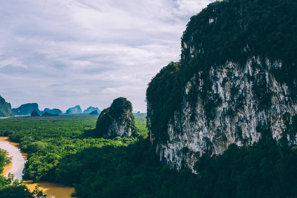 Aerial scenery view of mangroves forest, river canals and mountains. Bird's eye view of beautiful panoramic nature landscape of tropical water jungle on Ao Phang Nga bay National Park, Thailand - Foto, afbeelding