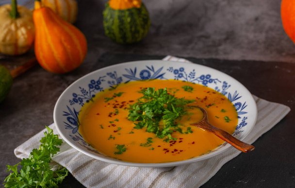 Delicious sweet soup with chilli and herbs - Фото, изображение