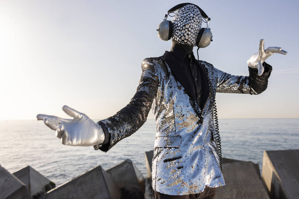 Mr disco man with sparkly face and headphones - Photo, Image