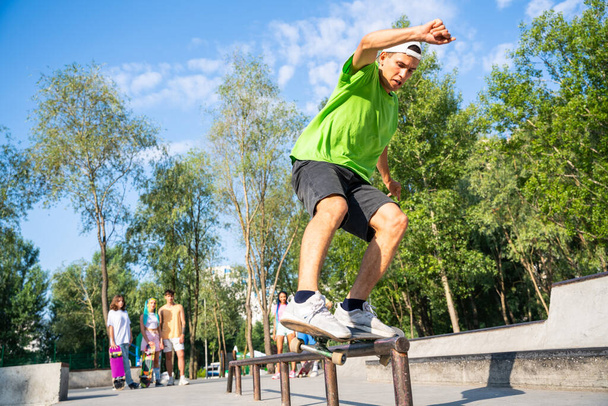 professional skateboarders having fun at the skate park - Фото, изображение