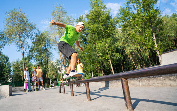 professional skateboarders having fun at the skate park - Фото, зображення