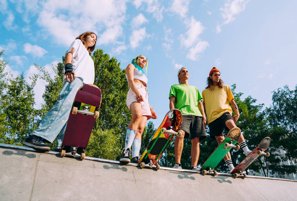 professional skateboarders having fun at the skate park - Fotografie, Obrázek