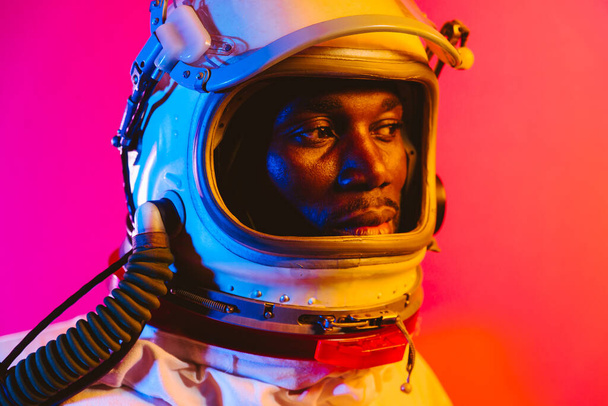 Cinematic image of an astronaut. Colorful portrait of a man with spacesuit - Fotografie, Obrázek