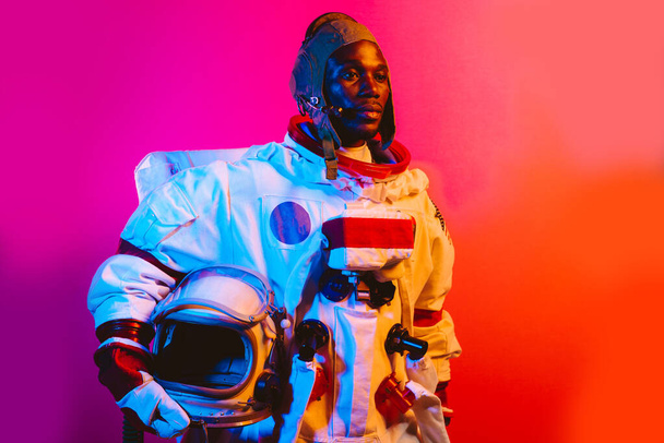 Cinematic image of an astronaut. Colorful portrait of a man with spacesuit - Fotó, kép