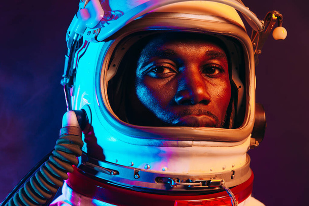 Cinematic image of an astronaut. Colorful portrait of a man with spacesuit - Foto, Imagen