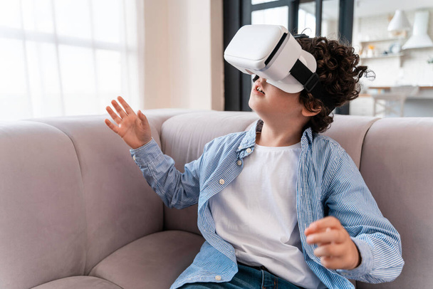 Little kid using vr glasses. Concept about childhood and technology - Valokuva, kuva