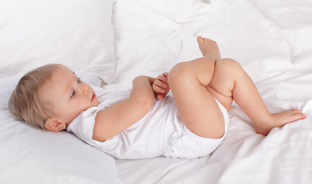 Beautiful baby in bed at home - Photo, image