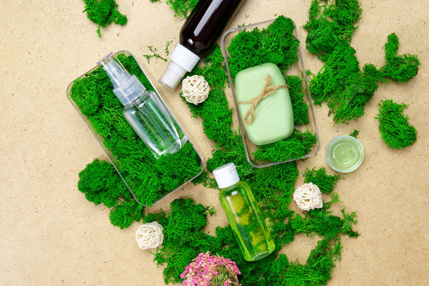 Spa and pampering products. Skin care creams, on green moss. Safe organic cosmetics. - Photo, Image