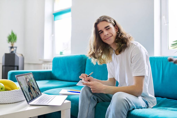 Individual online lesson, teenage boy studying at home with laptop - Foto, Imagem