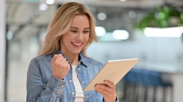 Young Casual Woman Celebrating Success on Tablet , Winning - Foto, Imagem
