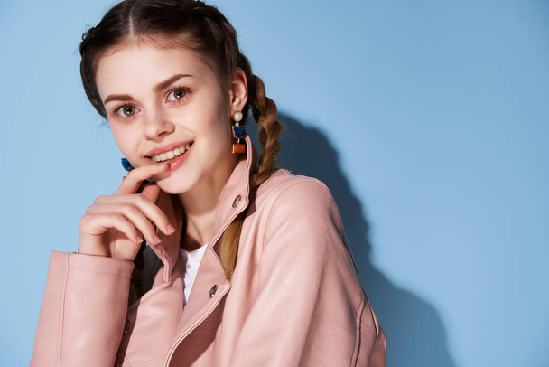 cheerful woman with pigtails in a pink jacket smile cosmetics posing - Valokuva, kuva
