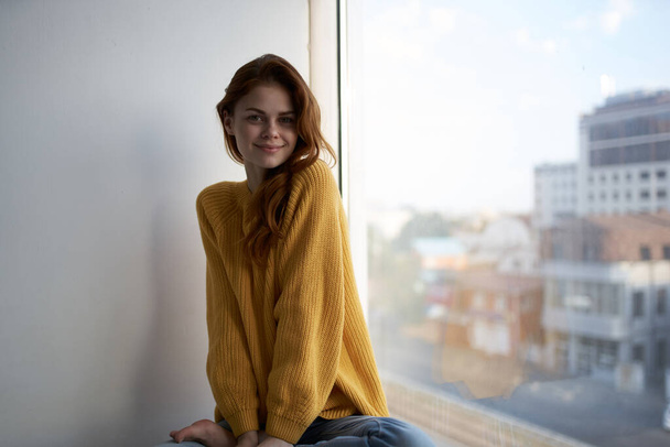 red-haired woman in a yellow sweater Lifestyle - Fotoğraf, Görsel