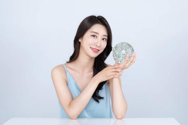beauty concept, Asian woman holding skin collagen object - Φωτογραφία, εικόνα