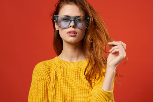 attractive woman holding hair glasses fashion yellow sweater - Photo, Image