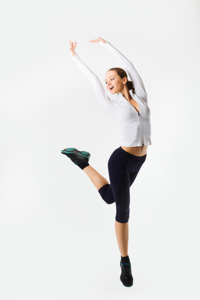 Weight loss fitness woman jumping of joy. Caucasian female model - Fotografie, Obrázek