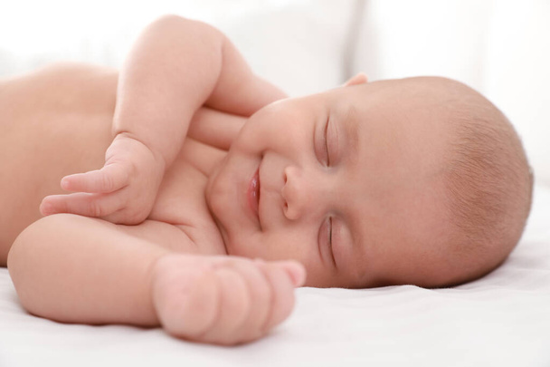 Cute little baby sleeping on bed, closeup - Photo, Image