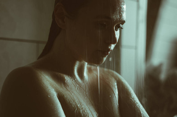 lifestyle moments of a young woman at home. Woman taking a shower in the morning - Photo, Image