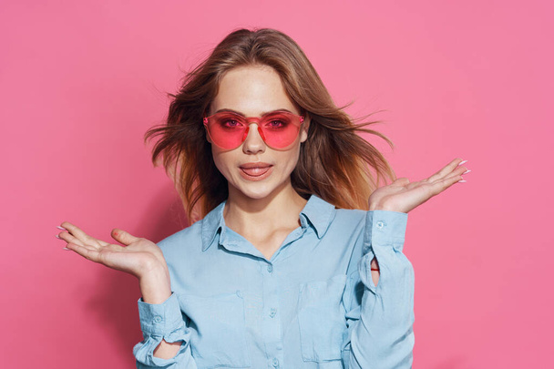 pretty blonde in pink glasses fashion luxury isolated background - Foto, imagen