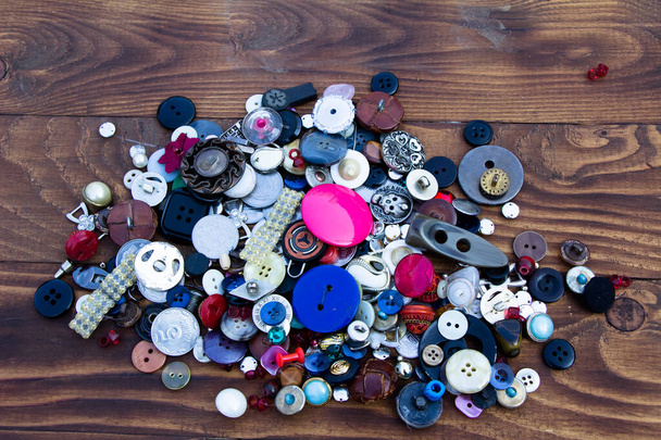 Different collections of buttons on a dark background - 写真・画像