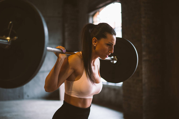beautiful woman training and making functional workout in the gym - Valokuva, kuva