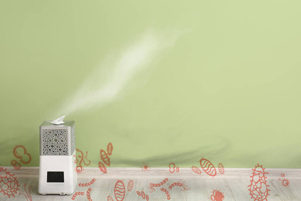 Antimikrobiální zvlhčovač na podlaze poblíž barevné stěny - Fotografie, Obrázek