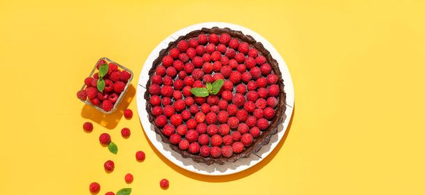 Composition with tasty raspberry pie on color background - Photo, Image