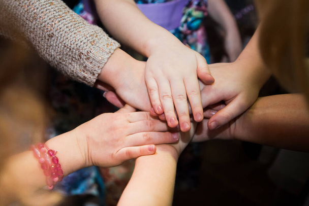 close up of a group of children hands together - Zdjęcie, obraz