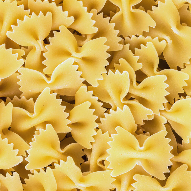 raw uncooked pasta on a white background - Φωτογραφία, εικόνα