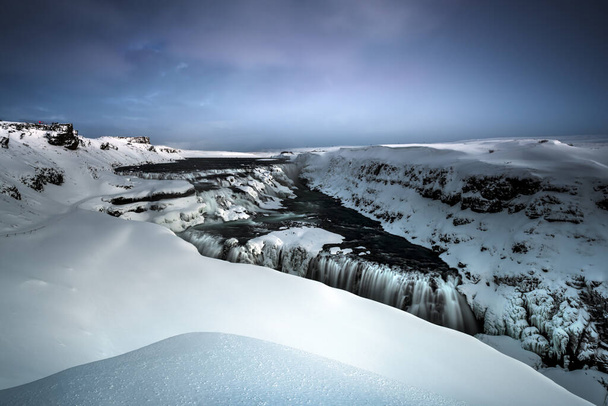 Amazing Landscape of a Beautiful Gullfoss. Snowy View of a Famous Icelandic Waterfall. Cold Winter Weather. Travel to Iceland.. - Zdjęcie, obraz