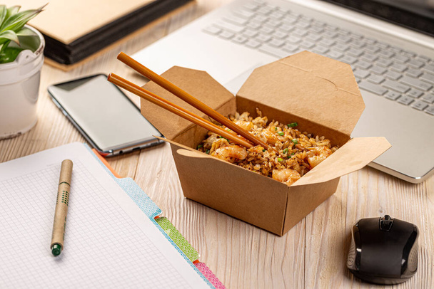 Lunch at the office concept. Chinese food delivery concept. Lunch box on office table. - Fotó, kép