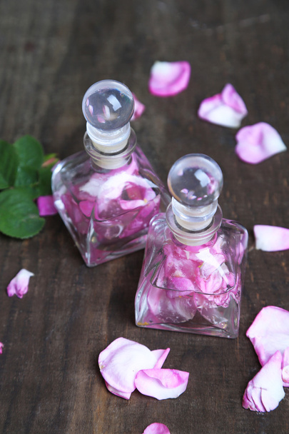 Rose oil in bottles - Foto, imagen
