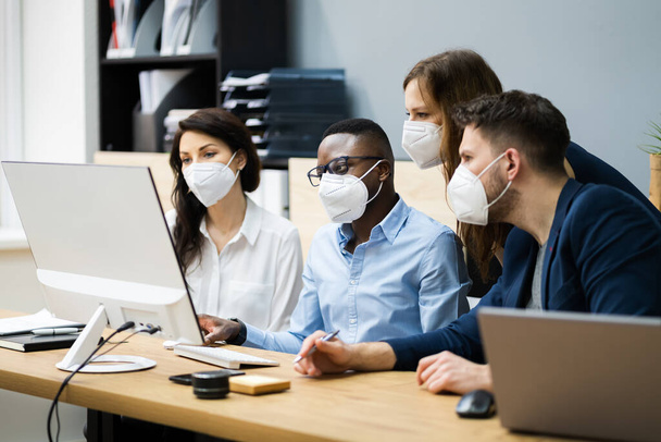 Mixed Group Of Young Business People In Face Masks - Фото, зображення