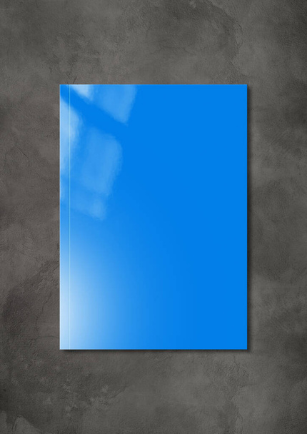 Blue booklet cover isolated on dark concrete background, mockup template - Foto, imagen