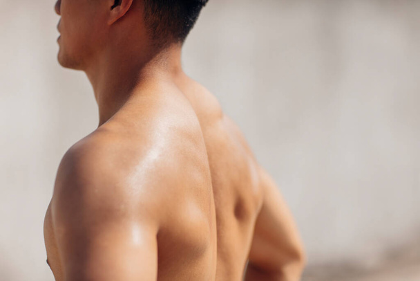 young man with muscular body on the beach - Φωτογραφία, εικόνα