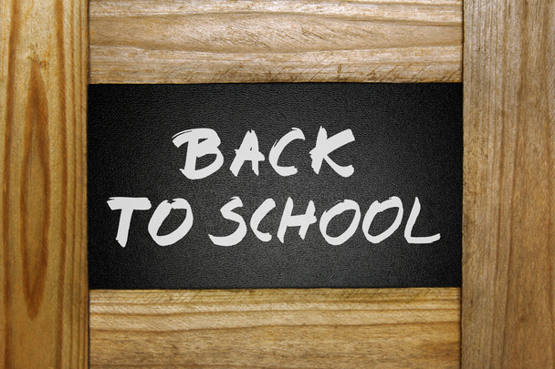 Back to school handwritten on blackboard in wooden frame - Foto, Imagen
