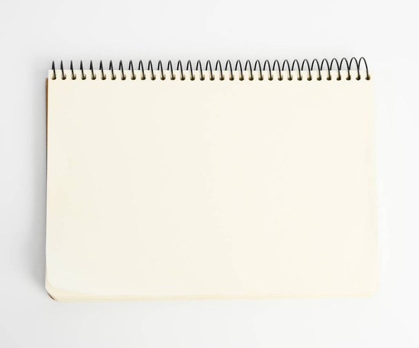 open spiral notepad with blank white sheets on white background, copy space - Fotó, kép
