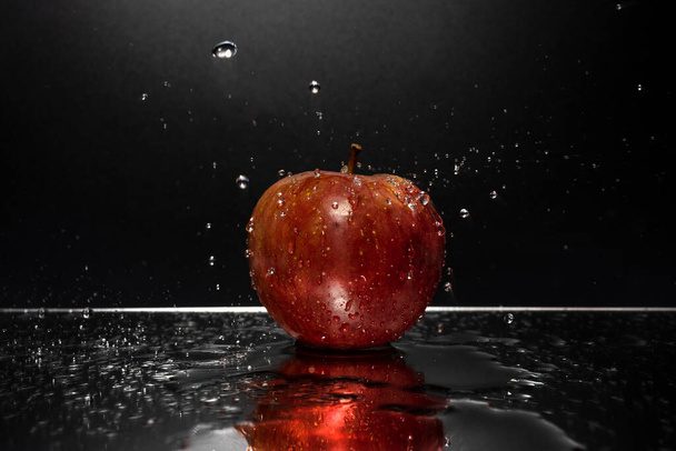 red apple with water drops on black background - Valokuva, kuva