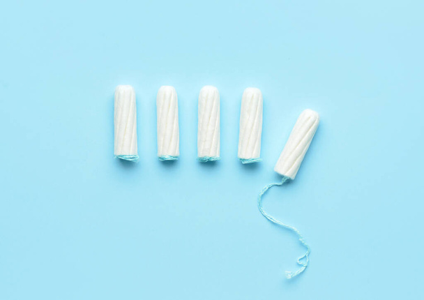 Tampons on color background, top view - Фото, изображение
