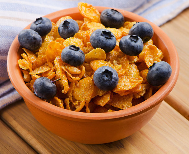 Corn flakes with blueberries - 写真・画像