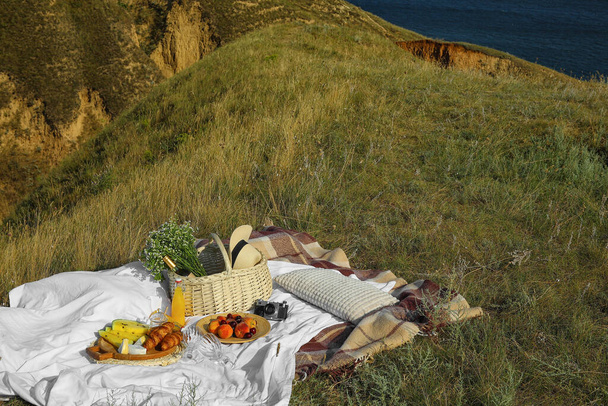 Tasty food and drink for romantic picnic outdoors - Photo, Image